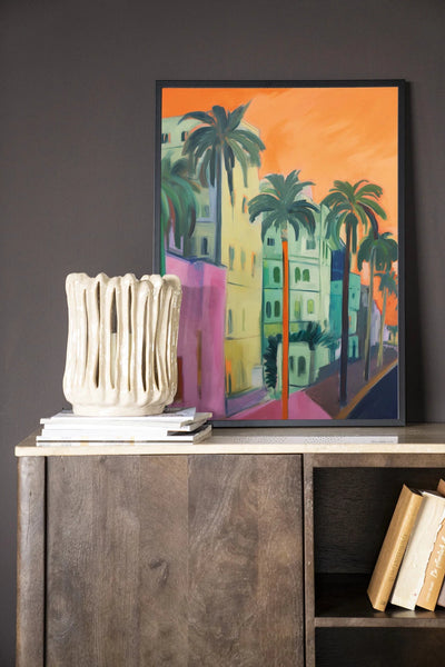 Moderne wanddecoratie van Urban Cotton met kunstprint, glaskunst en wandkleed, afgebeeld met houten lijst in zwart.